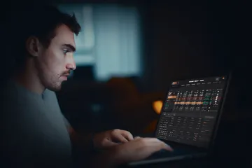 A cheerful woman in traditional clothing using her smartphone during a festive moment, showing how easily the 1777BET888 app fits into everyday life.