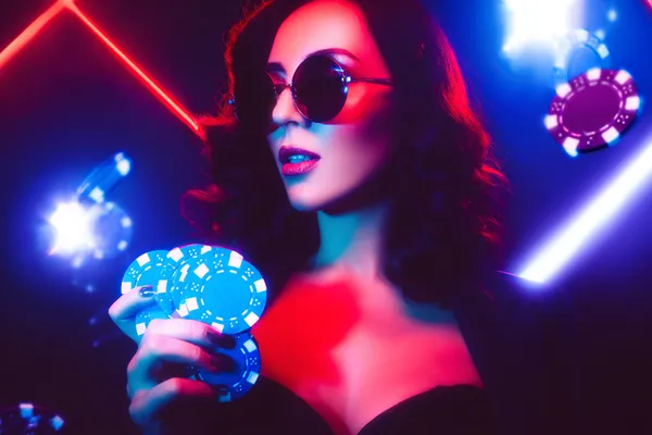 A player using their smartphone during a festive local event, representing 1777BET888’s fully mobile-friendly casino.