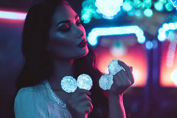 1777BET888 Member Login — Return to your personalized dashboard A person using their device against a moody casino-themed background, illustrating the smooth re-entry process at 1777BET888.